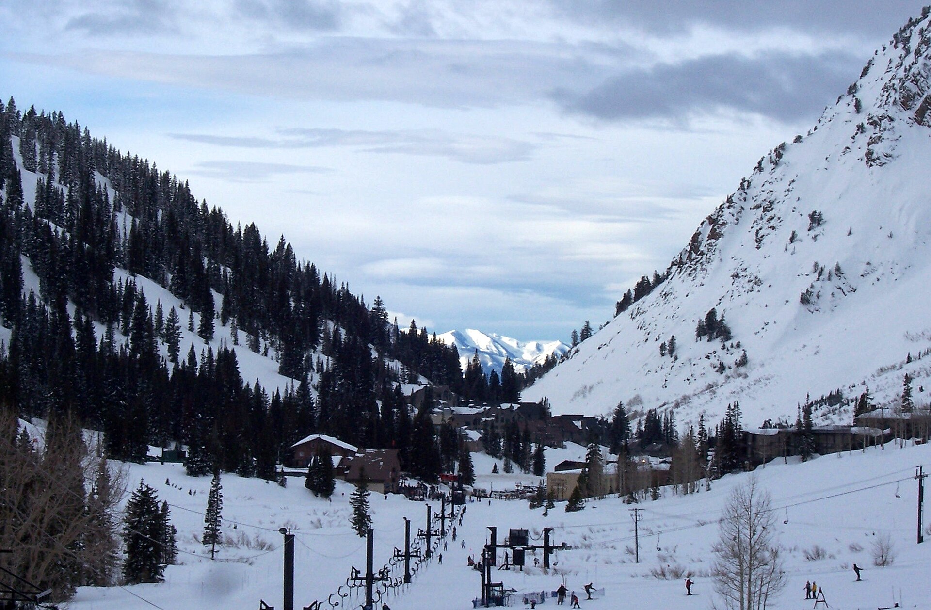Snow-covered slopes of upper Little Cottonwood Canyon at Alta ski area under a winter sky