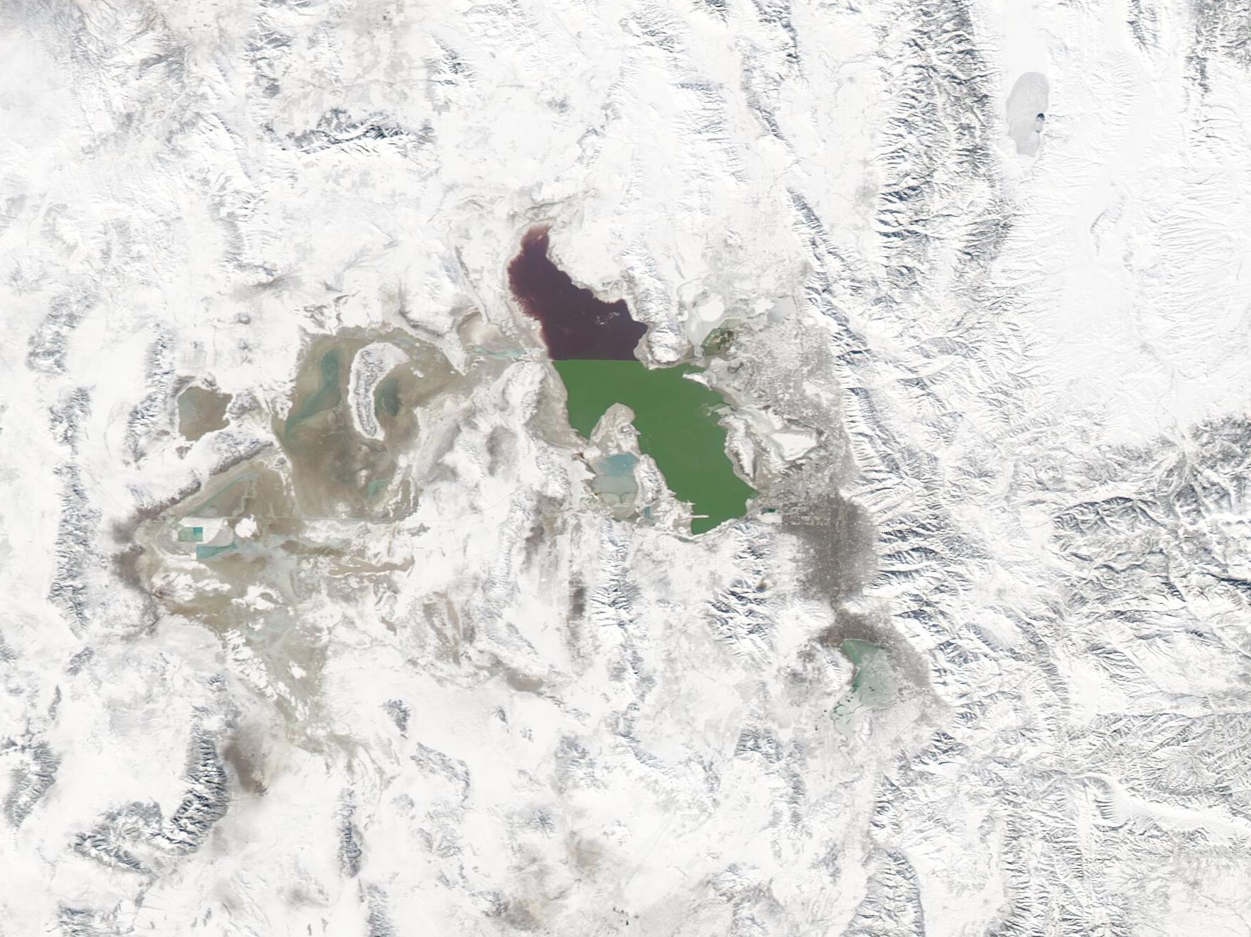 NASA satellite view of snow blanketing the Wasatch Range around the unfrozen Great Salt Lake